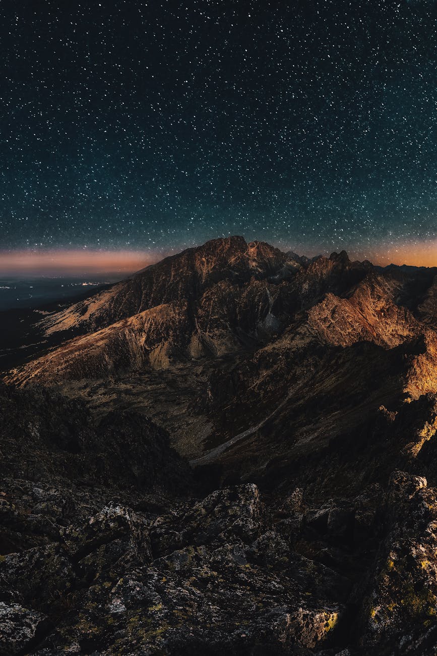 mountain at night under a starry sky